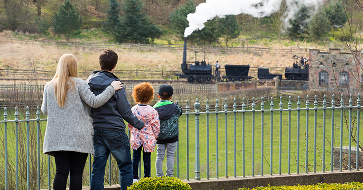 family watching steam engine at Beamish Museum 